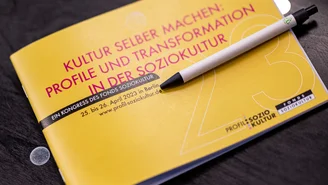 the programme booklet of the congress lies on a chair
