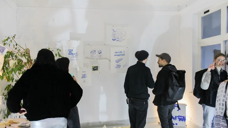 a group of young people at an exhibition